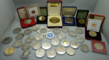 A collection of commemorative coins and medals, lucky Irish penny, Isle of Man, Libera coins, etc.