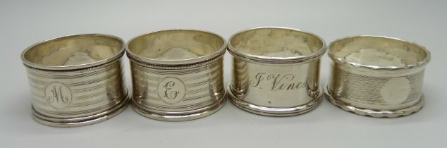 A pair and two single silver napkin rings, 54g