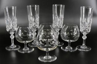 A set of four Baccarat brandy glasses, and a set of four Baccarat champagne flutes