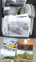 A box of mixed postcards and locomotive photographs