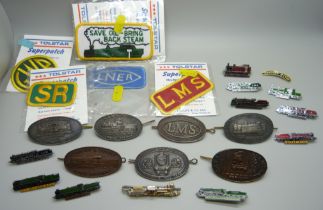 A collection of railway badges including cap badges and five patches