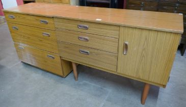 A small teak effect sideboard and matching chest of drawers