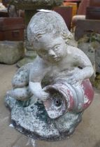 A concrete garden cherub figure water feature