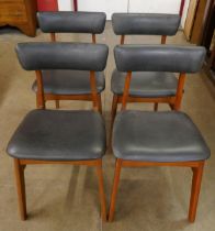 A set of teak dining chairs