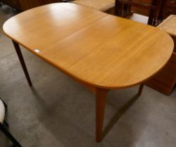 A teak extending dining table