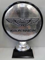 A large Aston Martin motoring emblem