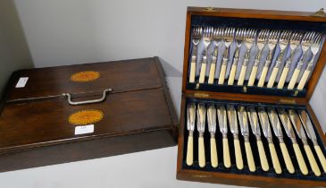 A cased set of silver plated and faux ivory handled fish knives and forks and an oak cutlery box