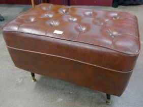 A brown vinyl pouffe