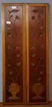 Two carved wooden panels