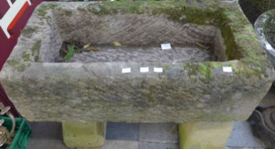 A rectangular concrete planter on pedestal stand