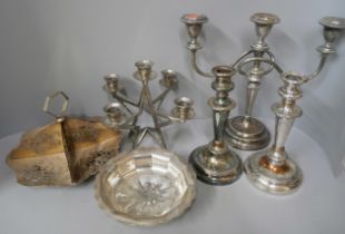 A large collection of silver plate; candlesticks, trays, goblets and cutlery, etc.