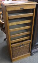 An early 20th Century oak tambour front filing cabinet (lacking key)