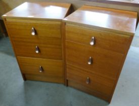 A pair of teak bedside chests