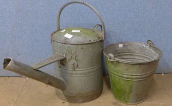 A galvanised bucket and watering can