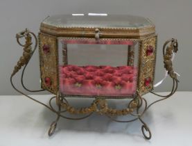 A glass and gilt metal jewellery box