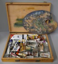 An artists easel and oils