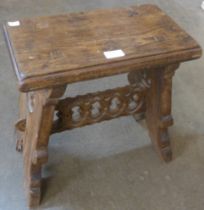 A Gothic style oak stool