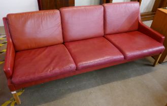 A Danish Thams crimson leather three seater sofa, designed by Rud Thygesen