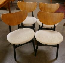 A set of four G-Plan Librenza tola wood and black butterfly-back dining dining chairs