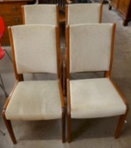 A set of four teak dining chairs