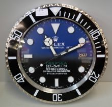 A Rolex style dealers clock