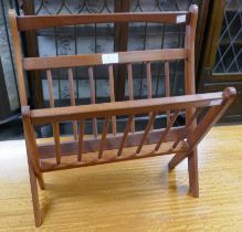 A teak folding magazine rack