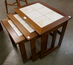 A Danish teak and tiled top nest of tables