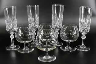 A set of four Baccarat brandy glasses, and a set of four Baccarat champagne flutes **PLEASE NOTE