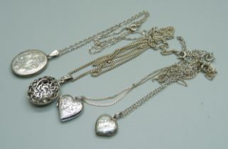 Four silver lockets and chains