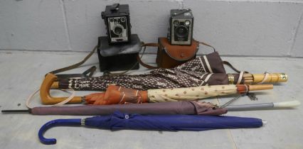 Four vintage umbrellas and two vintage cameras, Kodak Brownie and Conway **PLEASE NOTE THIS LOT IS
