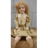 A German Adolf Heller bisque head doll, marked AH, 59cm