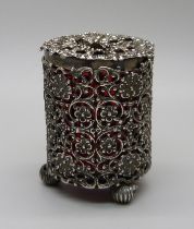 A Victorian silver ornate lidded spice pot with cranberry glass liner, Birmingham 1893