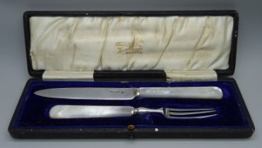 A silver and mother of pearl knife and fork christening gift set, cased