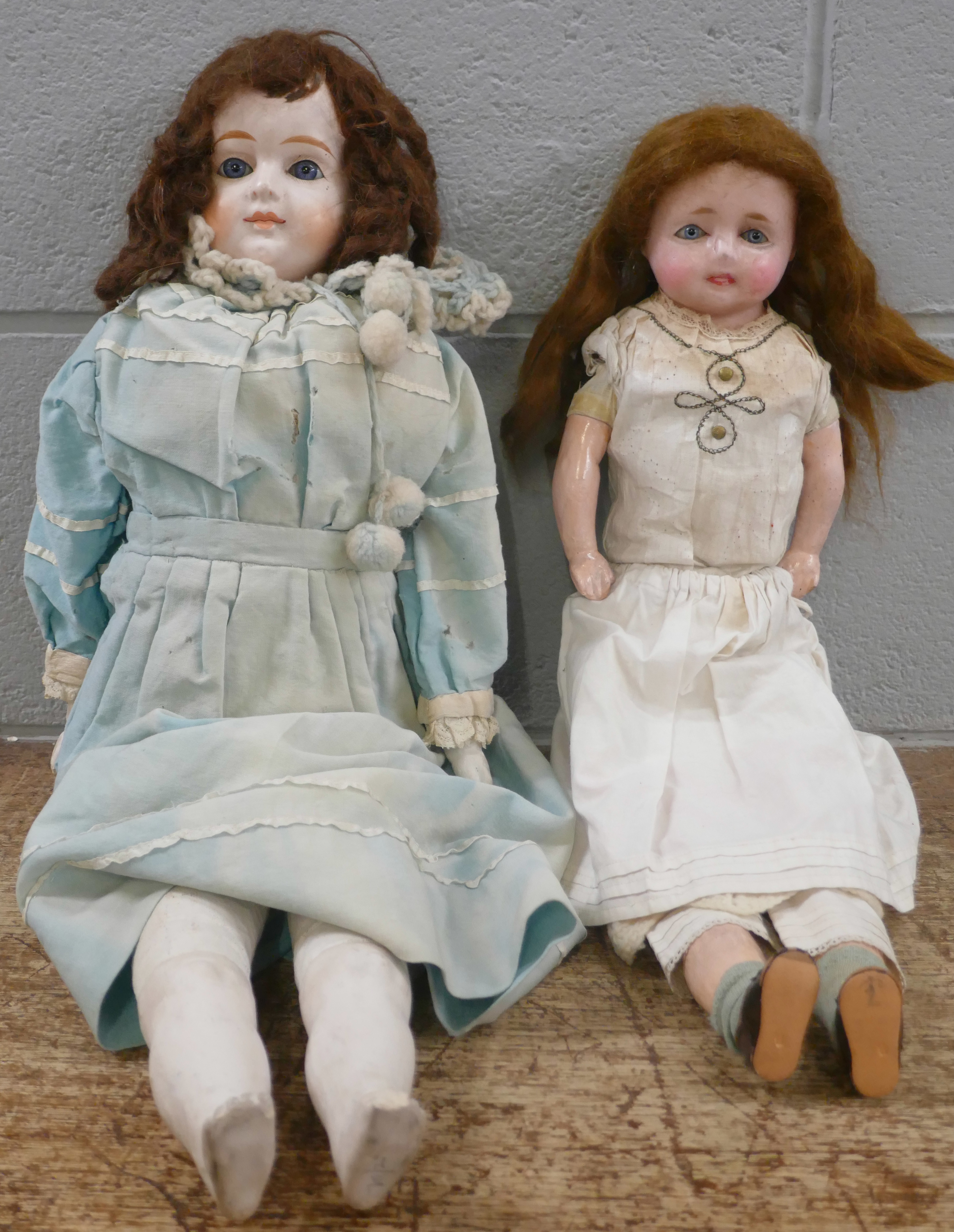 Two dolls; a Victorian composition doll and a wax over composition doll, 49cm/60cm