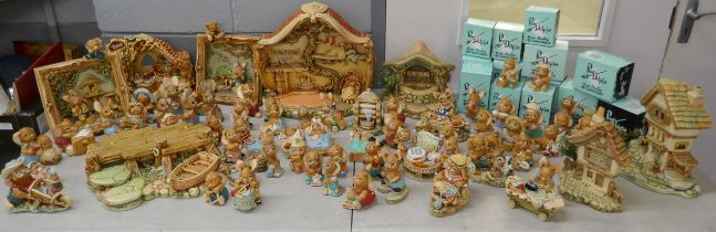 A very large collection of Pendelfin figures and large Pendelfin display stands including toy