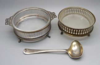 Two silver and glass butter dishes and a silver feeder spoon, 173g
