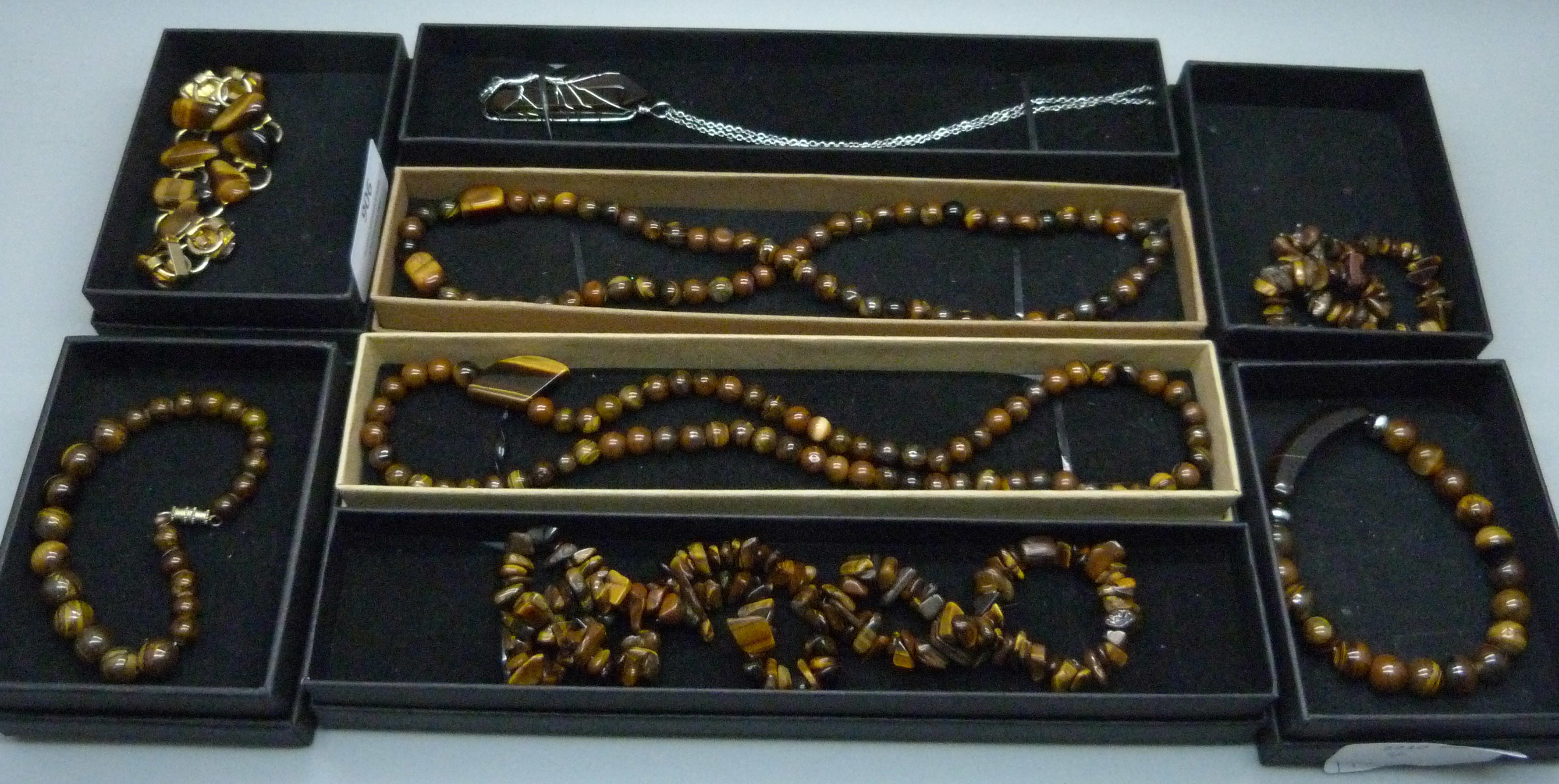 Four tigers eye necklaces and four bracelets