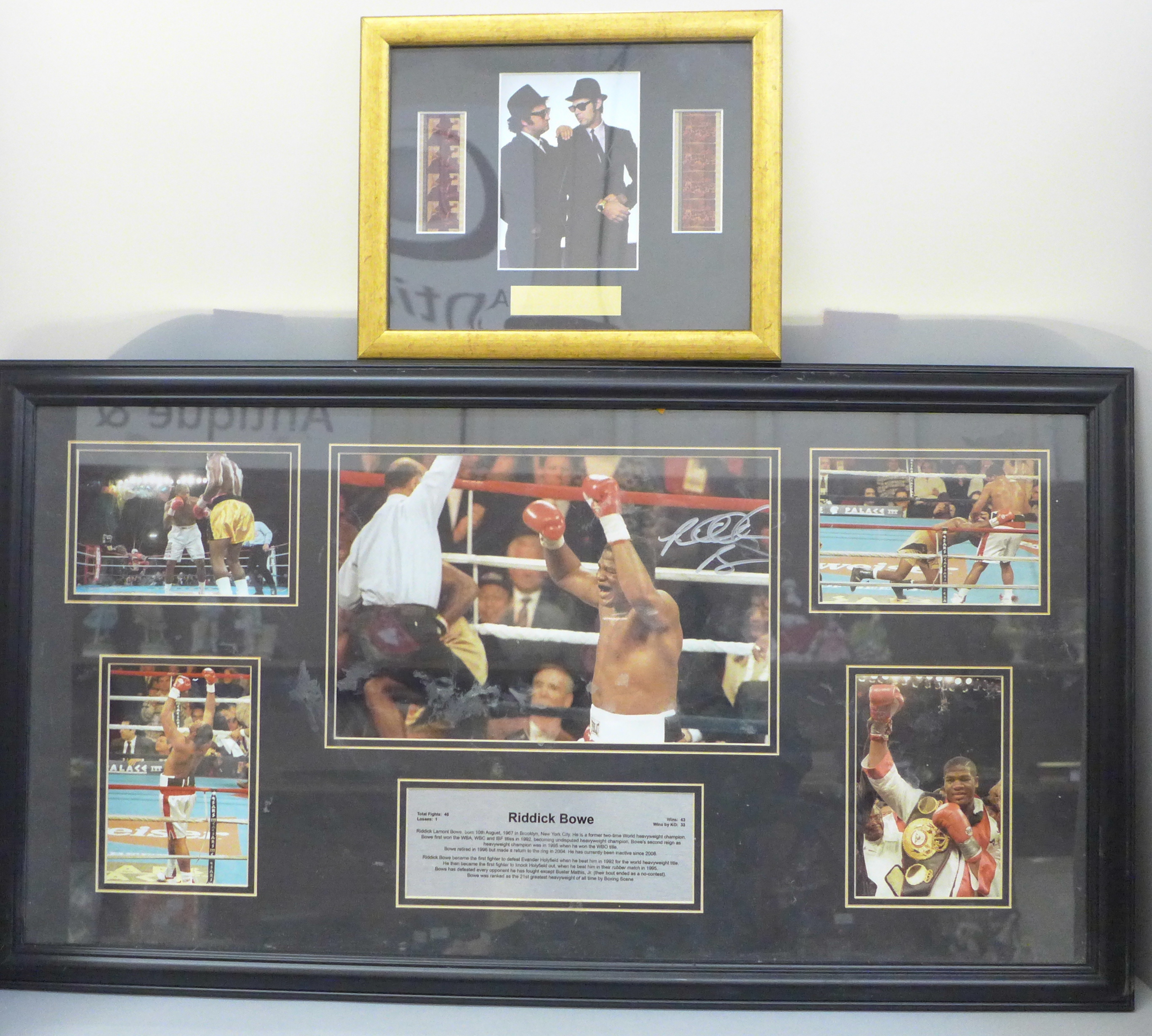 A Riddick Bowe photo montage, main photo signed, with presentation plaque, framed and a Blues