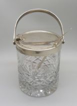 A cut glass and silver preserve jar and a silver spoon