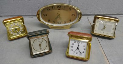 Four travel clocks and a retro Chinese clock