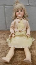 A German Armand Marseille bisque head doll, 390N with sleep eyes and composition body, 44cm