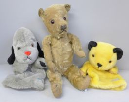 An early 20th Century Teddy bear and two modern Sooty and Sweep glove puppets, with squeak