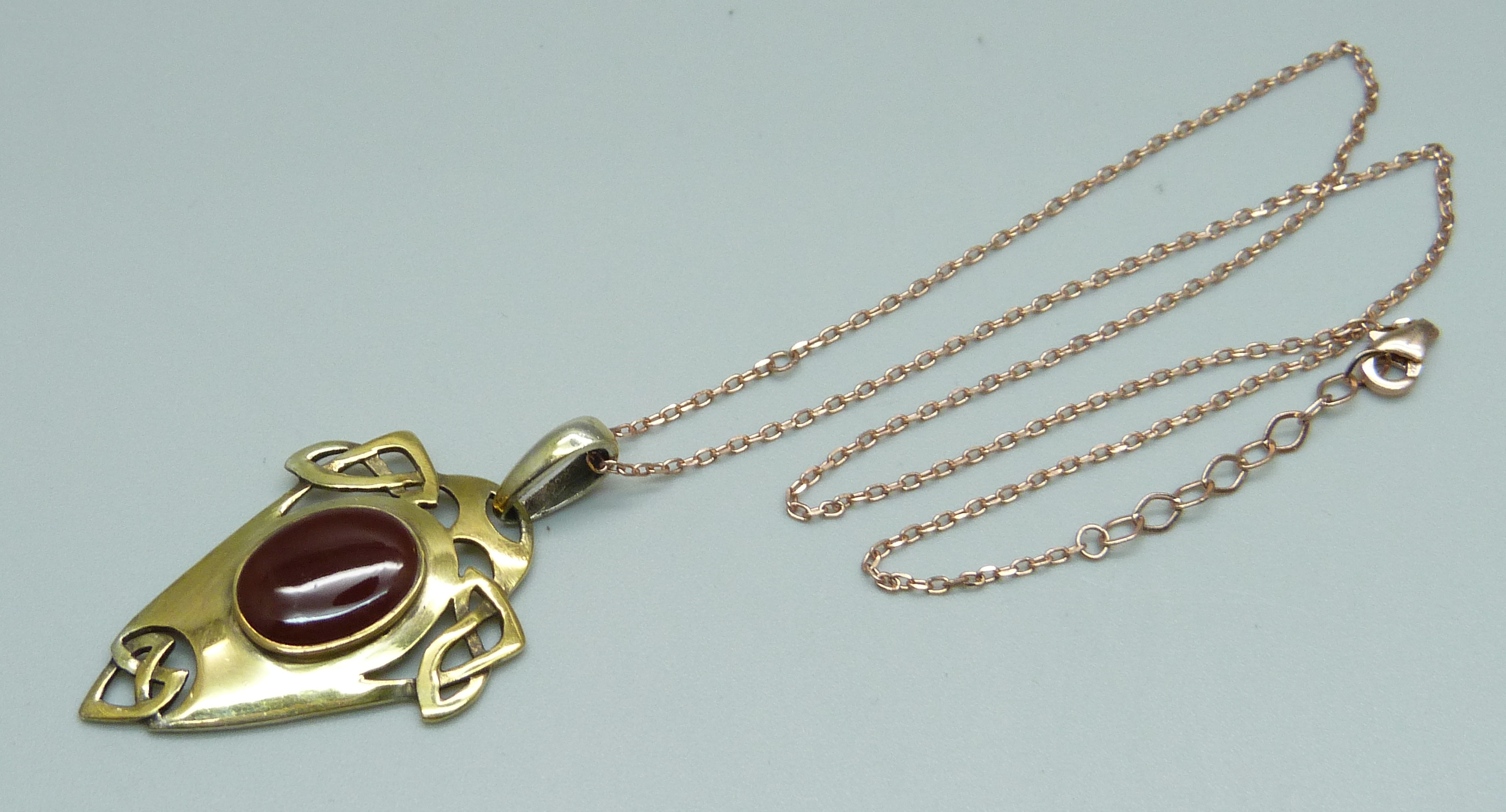 An Arts and Crafts 925 silver gilt pendant on chain