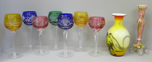 Seven etched coloured hock glasses, a coloured glass candlestick and vase **PLEASE NOTE THIS LOT