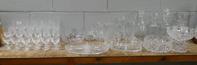 A suite of crystal and cut glass including a heavy bowl, heavy pedestal bowl, five decanters, two