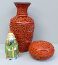 A Japanese carved cinnabar vase, lidded circular pot and a porcelain scent bottle