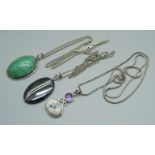 Three silver neck chains and three silver mounted pendants