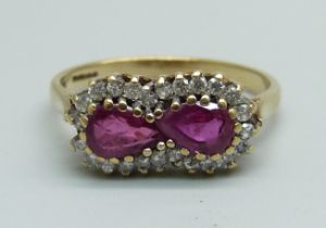 A 9ct gold, two ruby and diamond ring, 2.3g, M/N