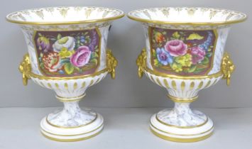 A pair of Royal Worcester two handled vases with floral decoration, 15.5cm