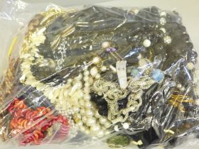 A collection of costume necklaces and bracelets including vintage